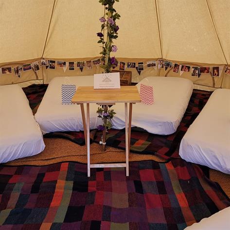 Interior of a 5m bell tent with beds